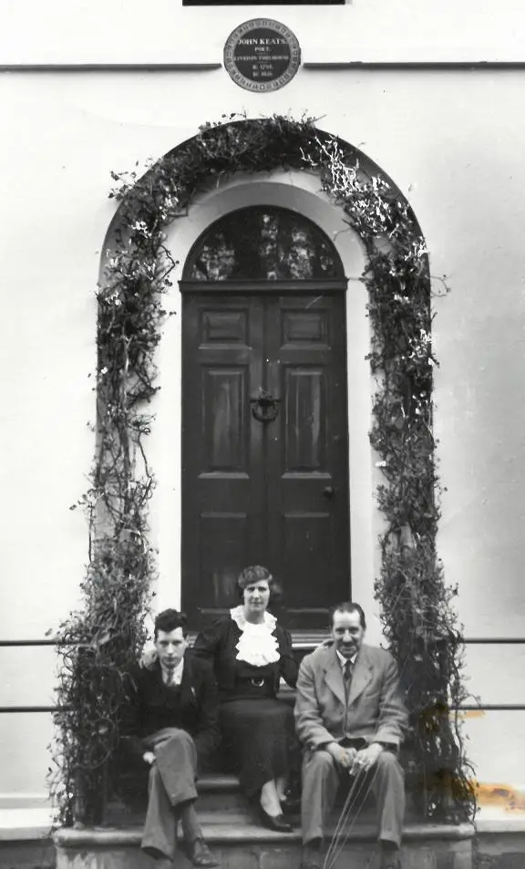 The first curator Fred Edgcumbe sitting on the steps of Keats House with his wife and son.